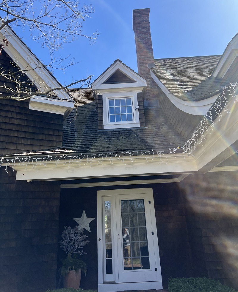 Pella Lifestyles awning window with SDL authentic grids in a dormer