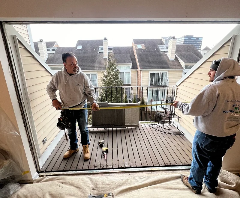Measuring the opening for for a Harvey vinyl patio door installation in Stamford, CT