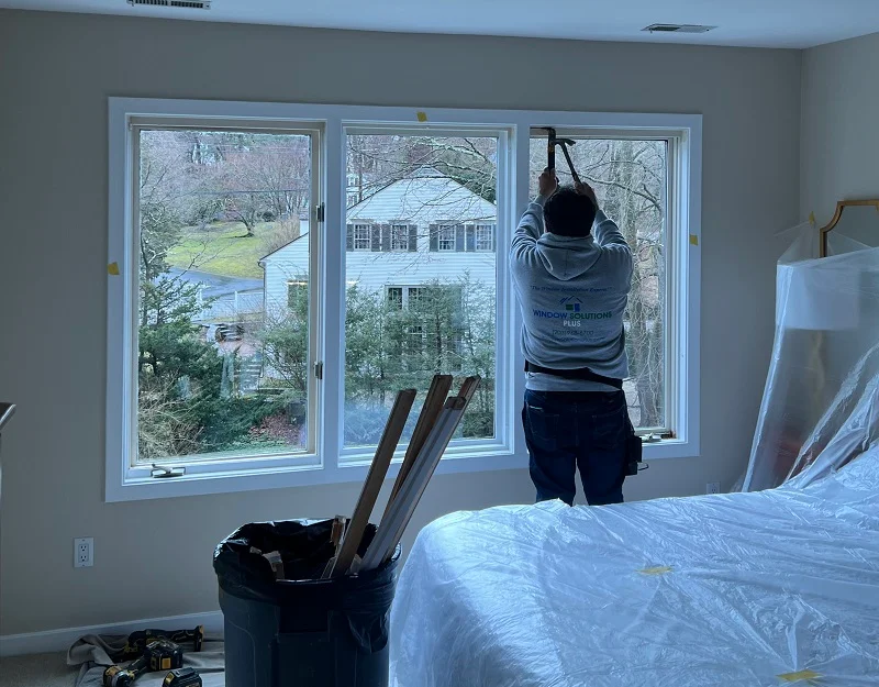 Window Solutions Plus expert installer beginning to remove old casement windows