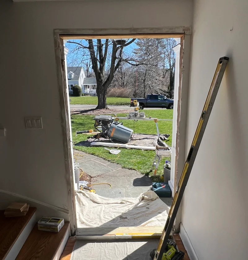 Wood door is removed and ready for a new Simpson door to be installed