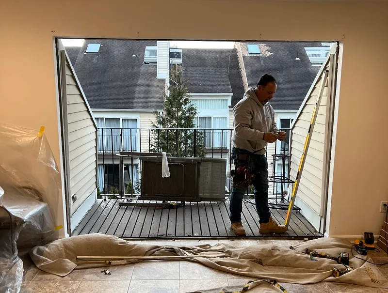 Window Solutions Plus checking level for this patio door installation in Stamford, CT