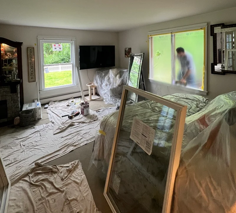 Plastic protecting the bed during window installation