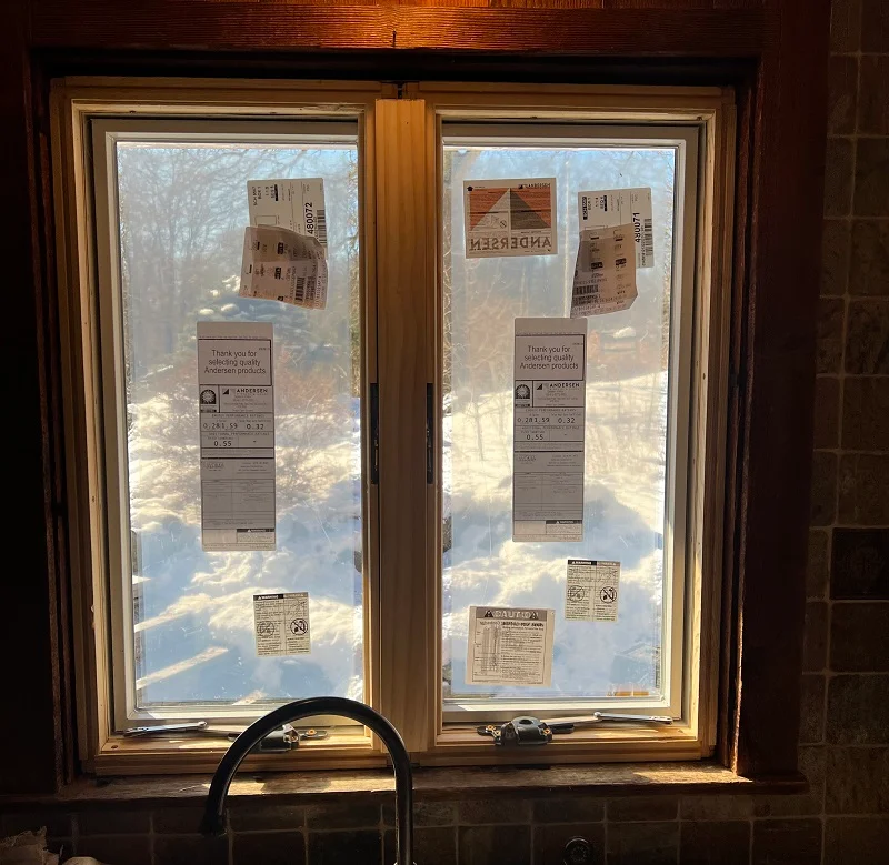 Andersen 400 Series double casement window installed above kitchen sink